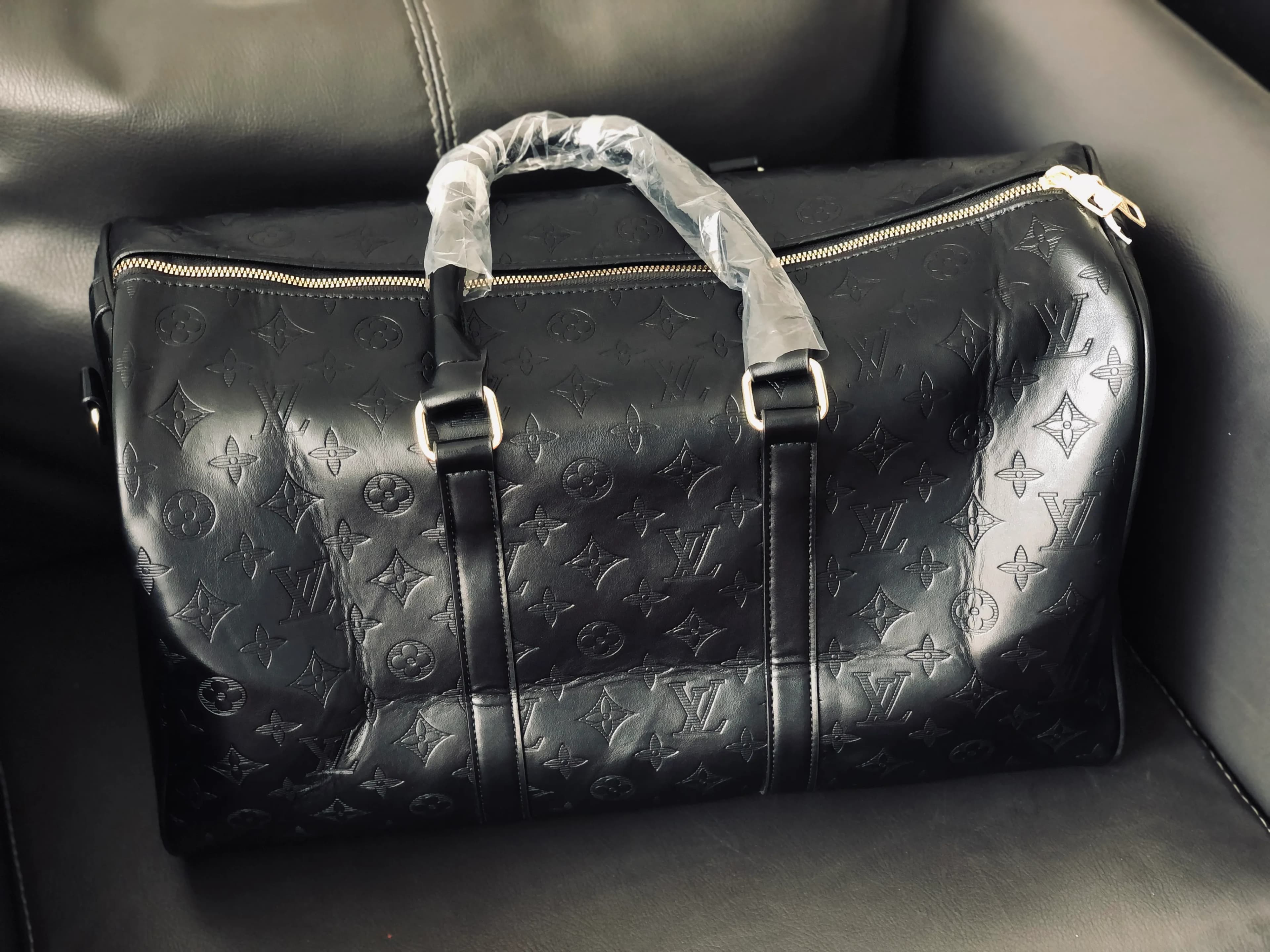 Monogram Shadow Embossed Leather Duffle Bag