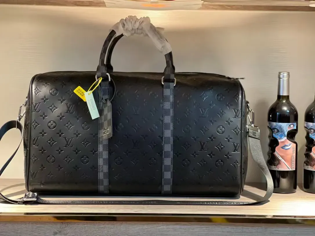 Louis Vuitton Keepall Bandoulière Embossed Monogram Duffle Bag